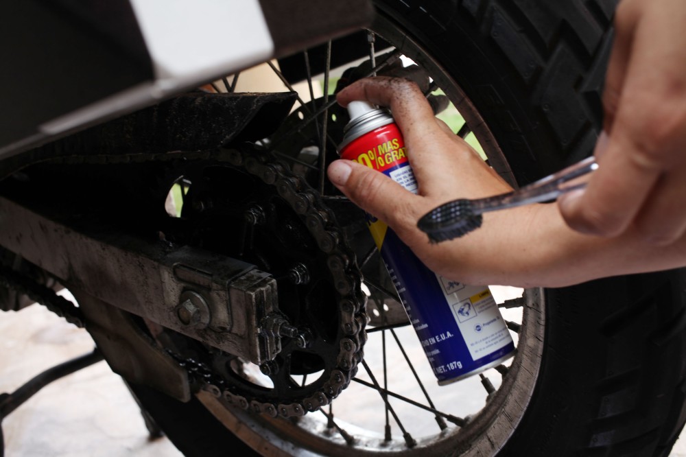 Motorcycle maintenance before we take off tomorrow. WD40 and some chain lube. (Photo: Nathaniel Chaney)