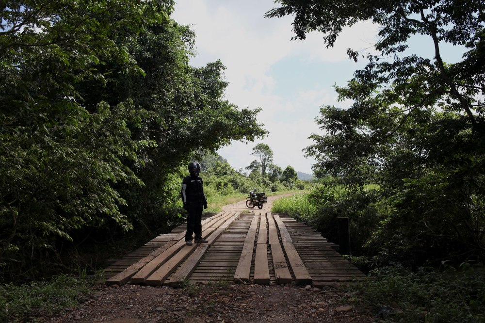 Nathaniel prepares to record me crossing a bridge along the gloriously names 'Coastal Highway'. Photo: Alex Washburn
