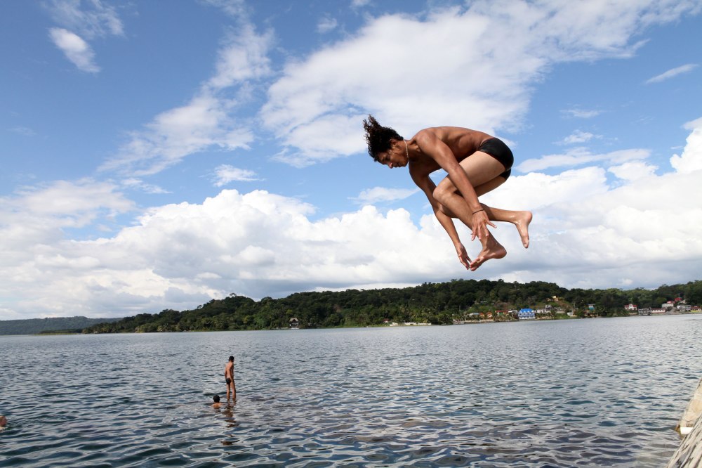 This is one of my favorite photos from Flores. Like so many men in town this kid showed up to the water, stripped into his underwear, dove and swam for about 15 minutes with a friend and then they hopped back on their scooter and left as quickly as they came. Photo: Alex Washburn