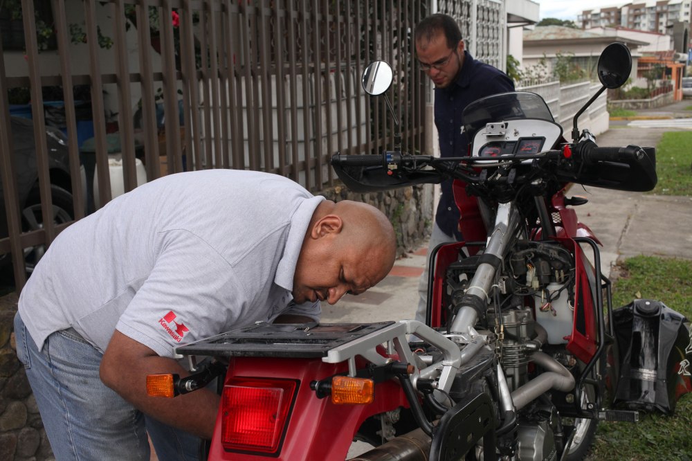 In San Jose we took the bikes into the Kawasaki dealership to have some basic maintenance done (chains cleaned, oil change, new clutch cable for Alex, replace Honda 50cc ignition coil on Nathaniel's bike since Farmersville). It was on the way back from the dealership Alex's bike blew the main fuse again. Replaced it and blew it instantly. Internet searches, e-mails/calls to gurus, and stripping the bike down yielded only knowing that there must be a short somewhere on the bike (Duh!). The mechanics from the dealership were dispatched over in the morning and finally found the short on the front turn signal. Bikes were nice and shinny for two whole hours before getting put back in the dirt. Photo: Alex Washburn
