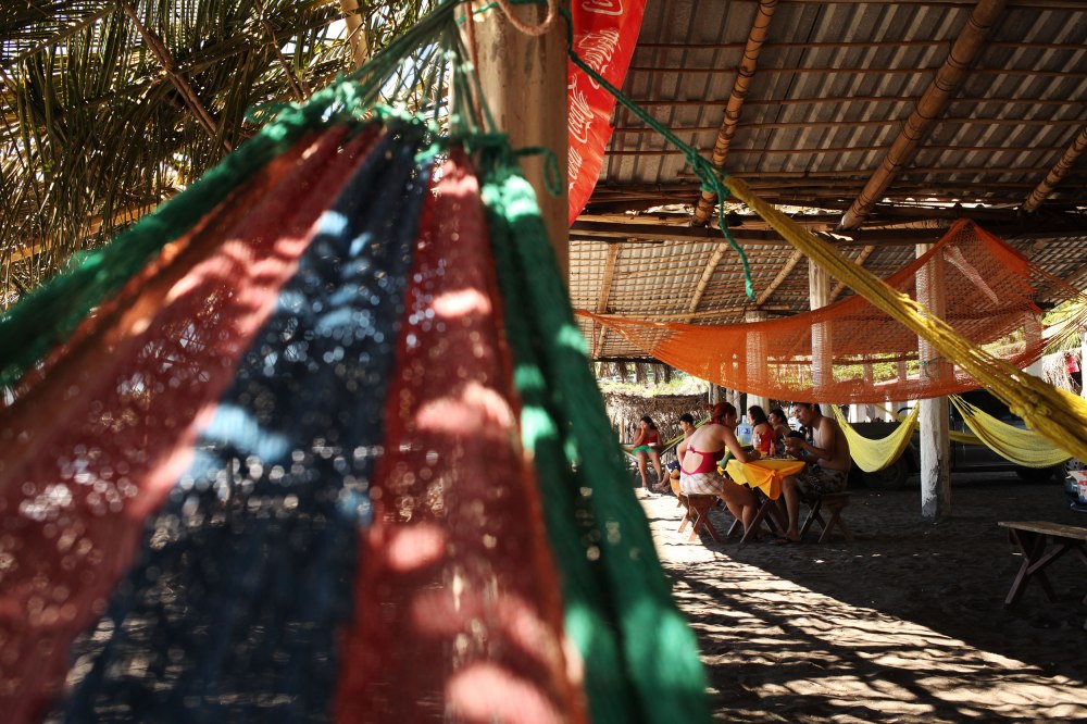 Families relax near the beach in Sunzal El Salvador. Photo: Alex Washburn