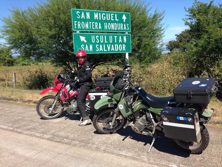 Alex poses next to a sign showing we are close to the Honduran border. Photo: Nathaniel Chaney