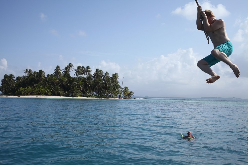 Nathaniel uses the Stahlratte's rope swing to jump into the ocean. Photo: Alex Washburn