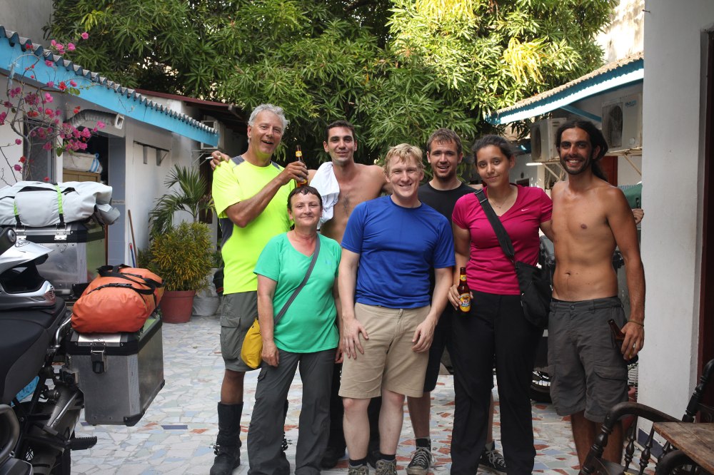 Ken, Diana, Jesse, Taylor, Nico, Nathaniel and I pose for a photo after victoriously getting our bikes through Aduana and the Colombian insurance office (it took all day). Photo: Alex Washburn