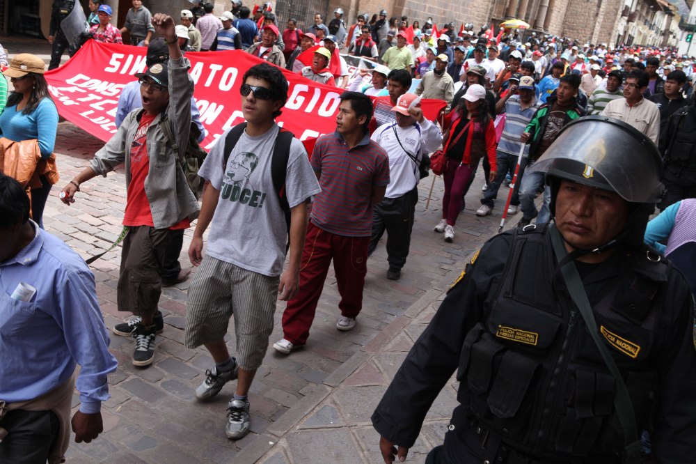 Protestors march through Cusco, Peru on Tuesday, Feb. 25, 2013. Thousands of people gathered from various regions of Peru to protest corruption within the Peruvian government and prevented traffic from flowing through the city. Photo: Alex Washburn