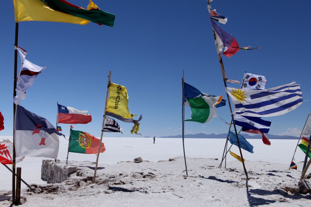If you visit the Salar de Uyuni I would suggest bringing a flag to add to the collection near the buildings where most of the tours stop for lunch. The fluttering colors are gorgeous against the the duo-chromatic surroundings.  Photo: Alex Washburn