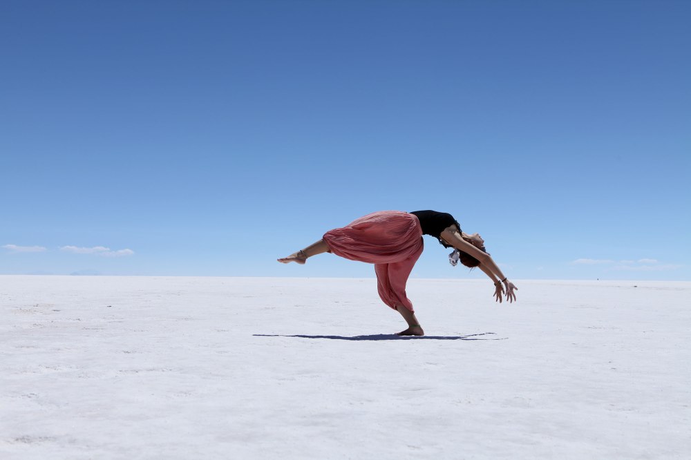 A Brazilian girl dances for her boyfriend's camera on the Salar de Uyuni. Tourists usually bring props to play with the strange perspective the salt flat creates but this was positively ethereal. Photo: Alex Washburn