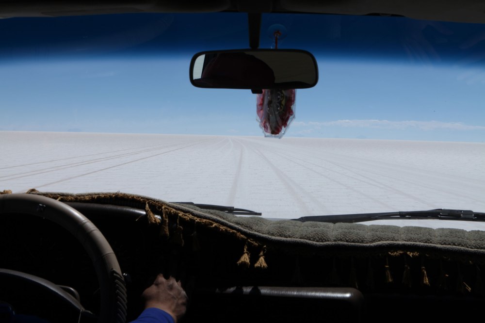Driving through the Salar de Uyuni is a strange experience. White hard packed salt stretches for miles in every direction and the local guides navigate across the expanse of nothingness using the surrounding mountains as navigational markers. Once we got out onto the salt flat we were glad we hadn't driven out there alone. Photo: Alex Washburn