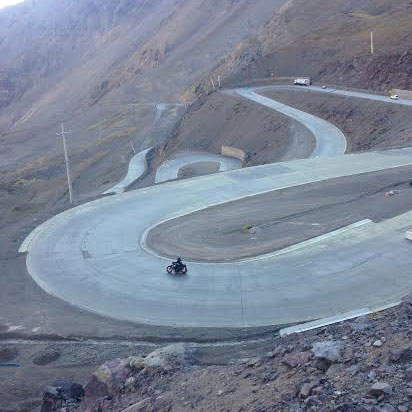 A Harley-Davidson starts to make its way down the infamous snail pass of Chile. Photo: Alex Washburn