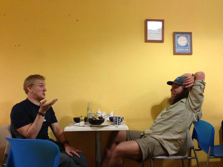 Nathaniel and Tobee swap stories over pastel de choclo (amazing chilean dish). Photo: Alex Washburn 